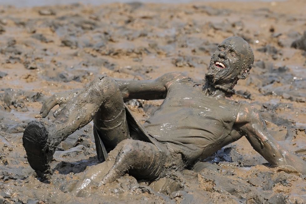 In Pictures: Mud glorious mud! Competitors raise charity cash in annual mud race