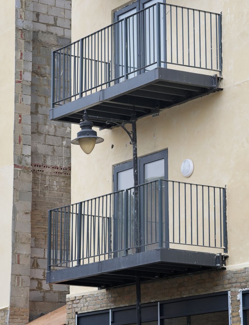 Developer builds balcony at block of flats around street lamppost