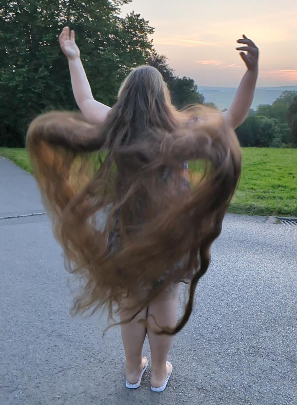 Woman with Rapunzel-style locks gets world record for longest hair donation