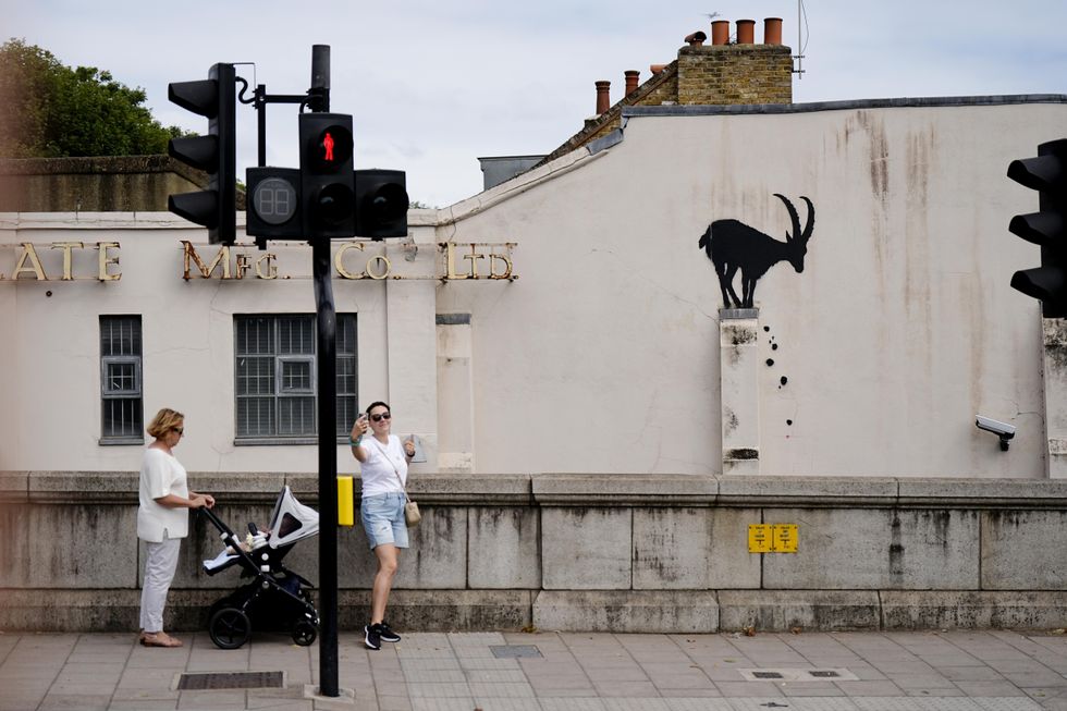 Banksy reveals new London artwork of goat perched on a wall