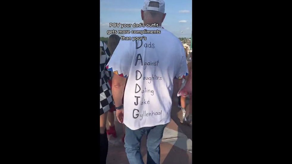 https://www.indy100.com/media-library/dad-goes-to-the-taylor-swift-concert-in-a-custom-shirt-made.jpg?id=33654062&width=980