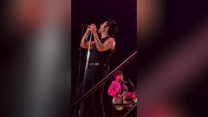 Harry Styles Covers 'Hopelessly Devoted to You,' Dresses as Danny Zuko