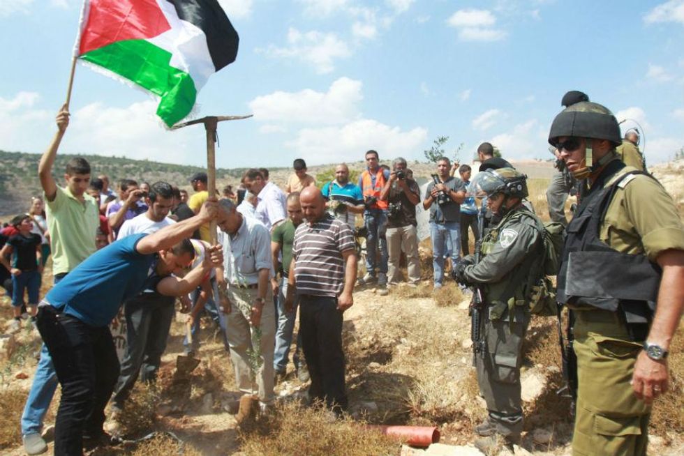 Protests break out in West Bank following Israeli land grab | indy100 ...