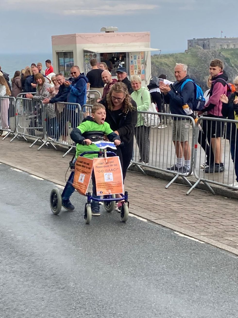 Boy, eight, with rare disease completes Ironkids Wales with walker