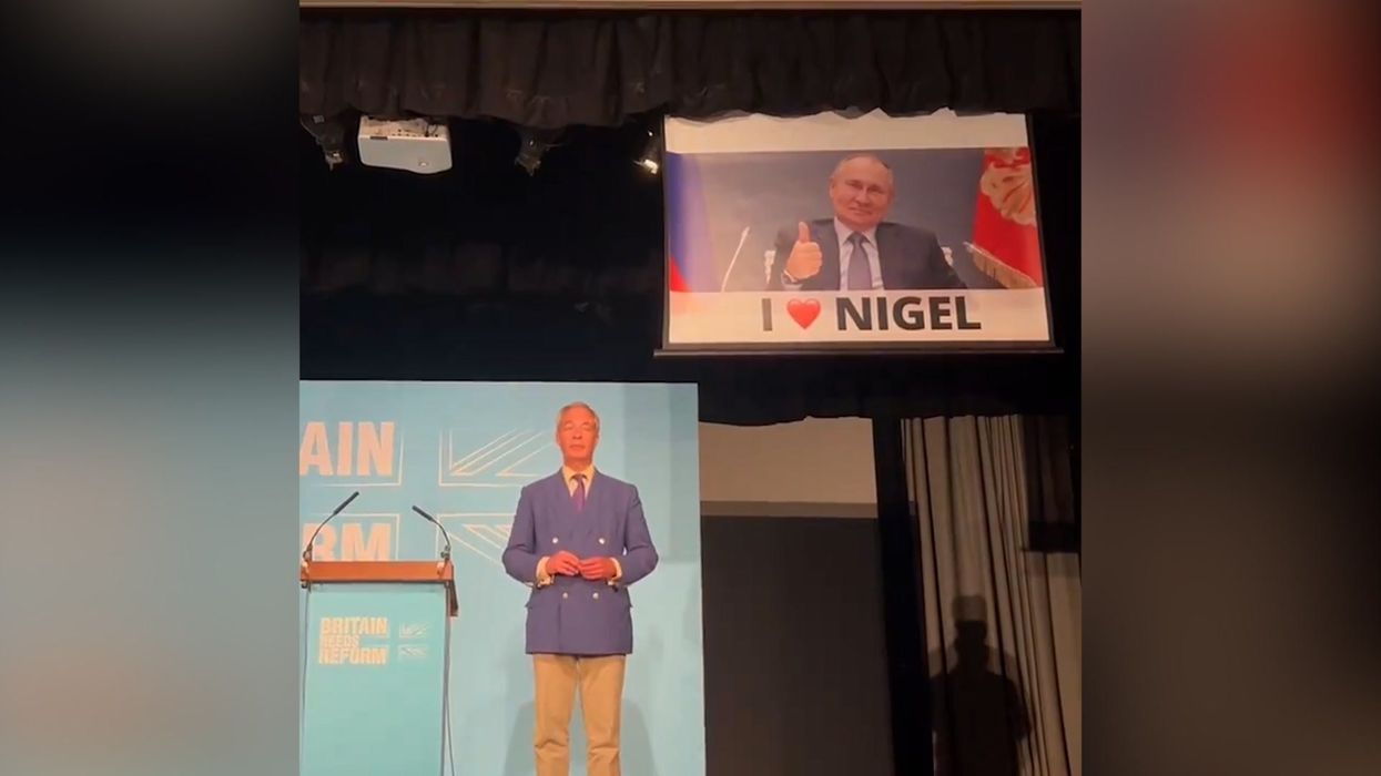Farage gets pranked during speech with banner of Vladimir Putin saying "I love Nigel"