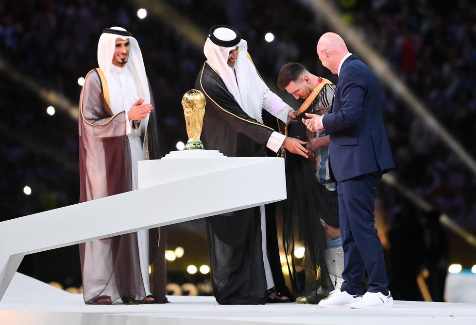 Why Was Lionel Messi Wearing A Robe During The World Cup Winners 