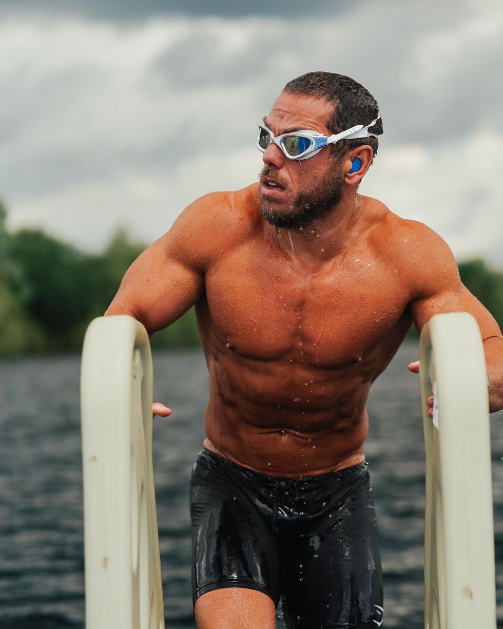 man getting out of water after swimming