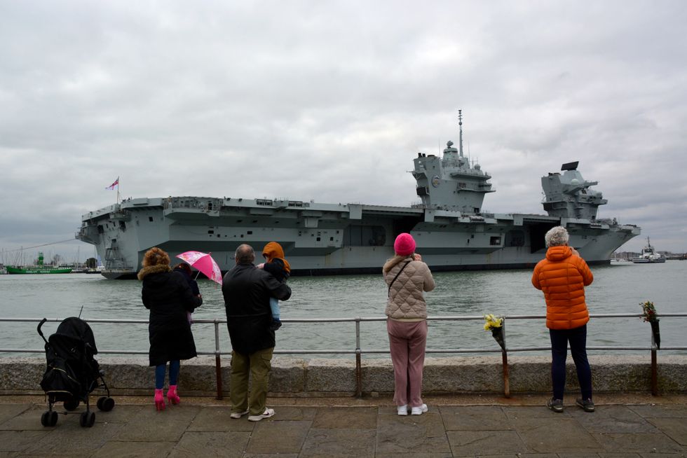 HMS Prince of Wales returns to port after hosting the King at sea