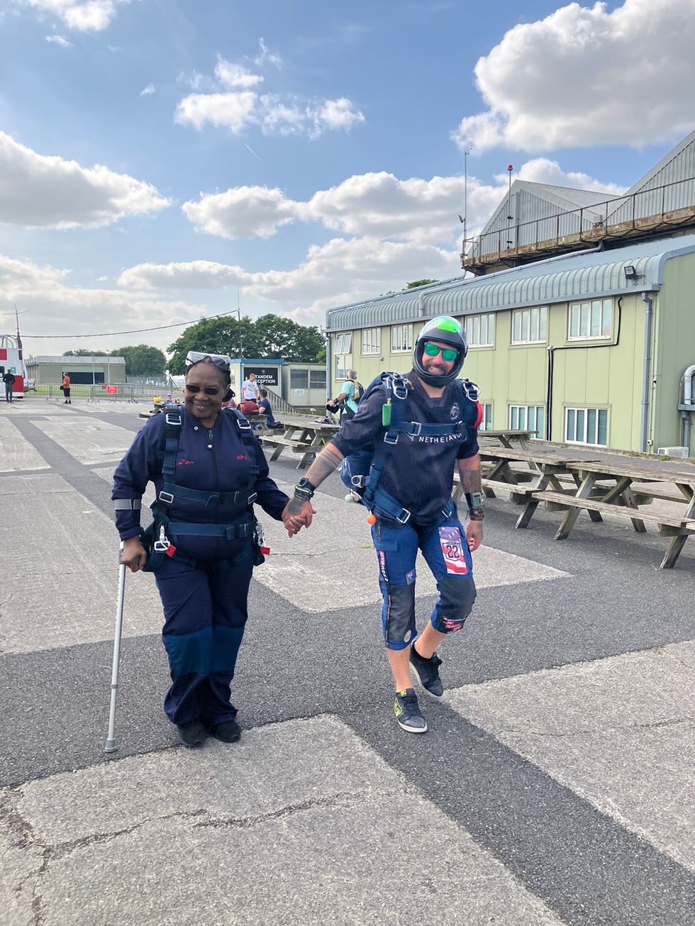 Retired nurse, 74, skydives to raise money for older people facing money worries