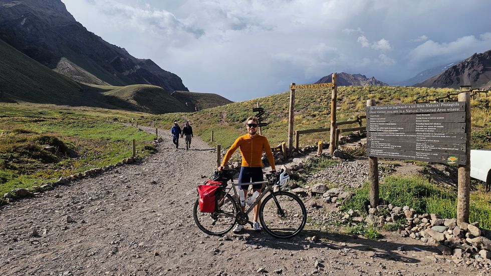 Briton completes cycle and climb from South America’s lowest point to highest