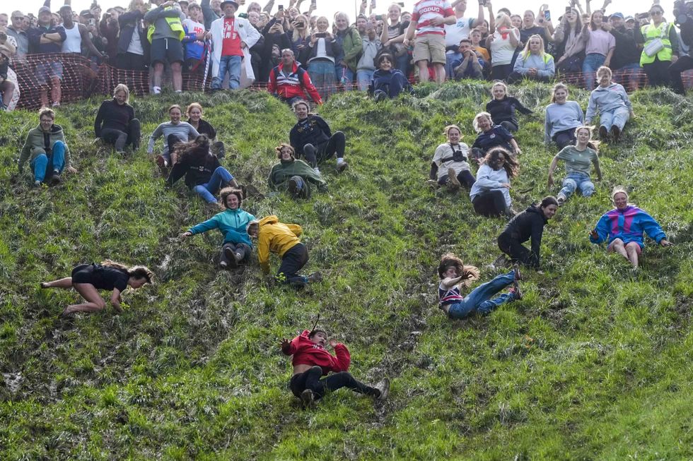 Daredevils defy weather for annual cheese rolling races