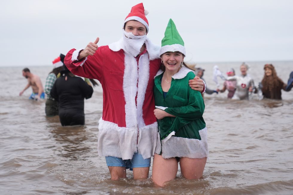 Christmas Day swimmers brave cool sea temperatures for festive dip