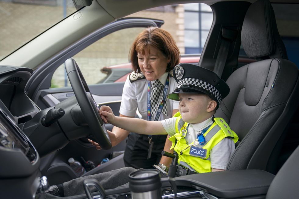 Boy, six, given special title after fundraising tour of 66 police stations