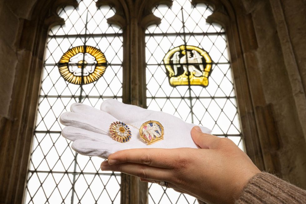 Brooches which copy London palace’s stained glass windows return home