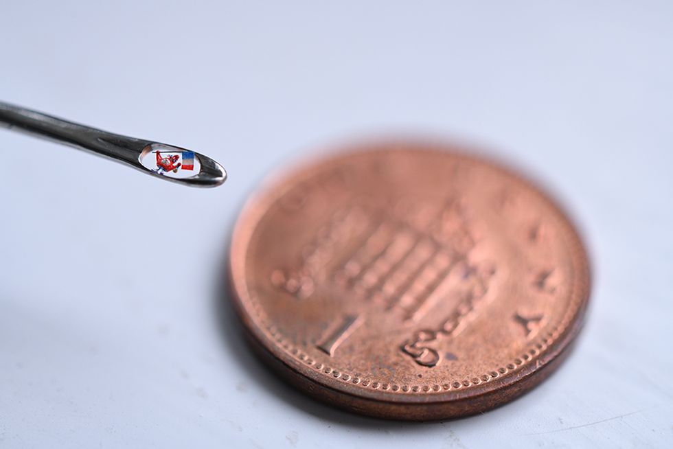 Renowned micro-sculptor unveils world’s smallest Olympic mascot for ...