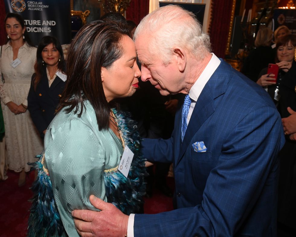 King shares traditional greetings with Maori attendee at charity launch