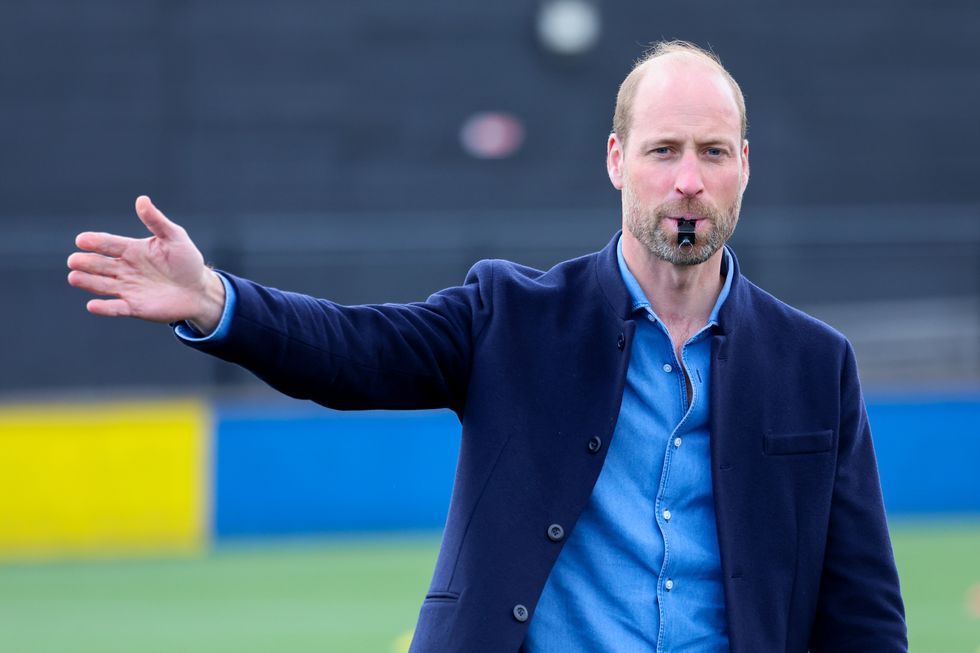 William poses for selfies with schoolchildren and referees football match