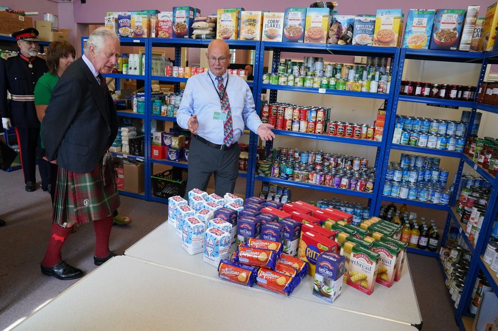 Charles makes donation while visiting Wick-based food bank